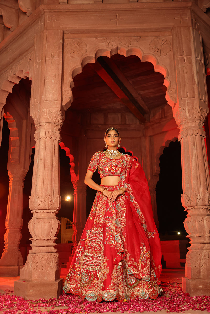Photo of Bride in a heavy red and gold bridal lehenga | Bridal lehenga  blouse design, Indian dresses, Wedding lehenga designs
